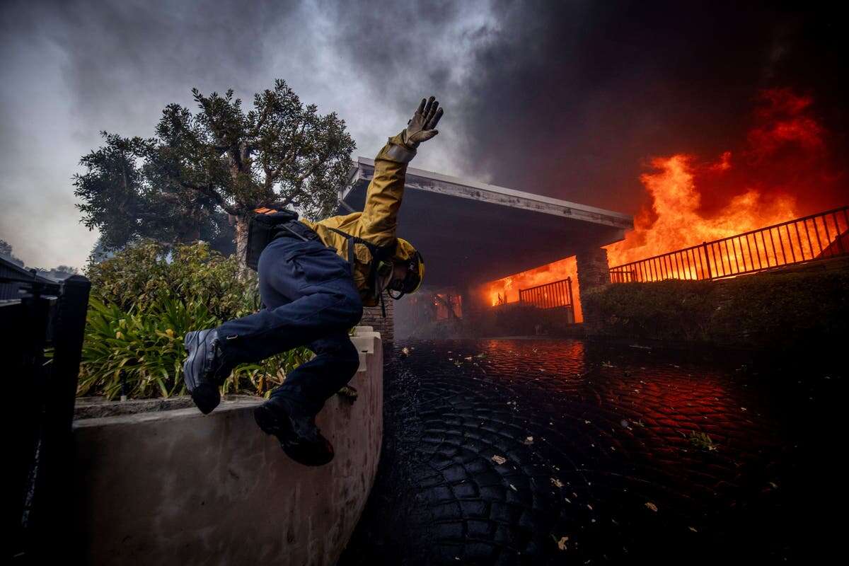 California governor says Pacific Palisades wildfire has destroyed many structures as winds kick up