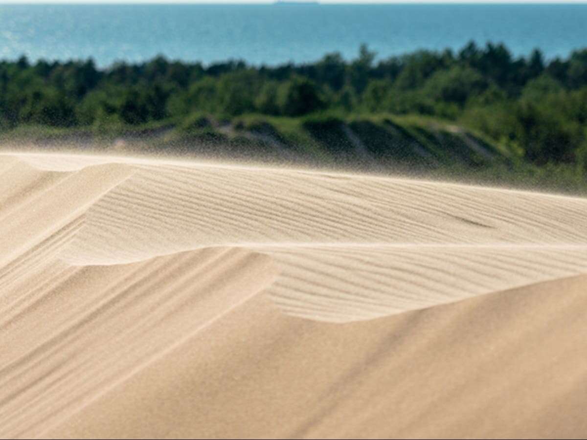 Boy is rescued by bystanders after being buried in sand for 14 minutes