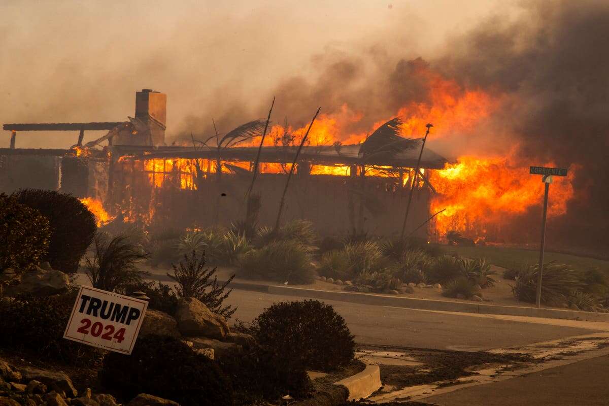 California homes engulfed by flames as blaze forces thousands to flee