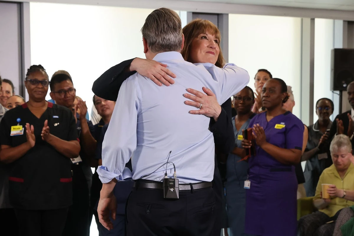 Reeves insists she’s ‘cracking on with the job’ as she hugs Starmer