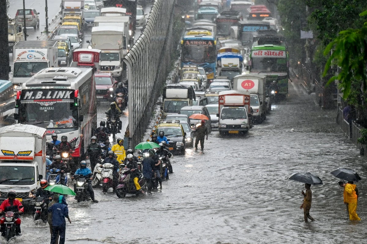 Storms and floods kill over a dozen as early rains batter South Asia
