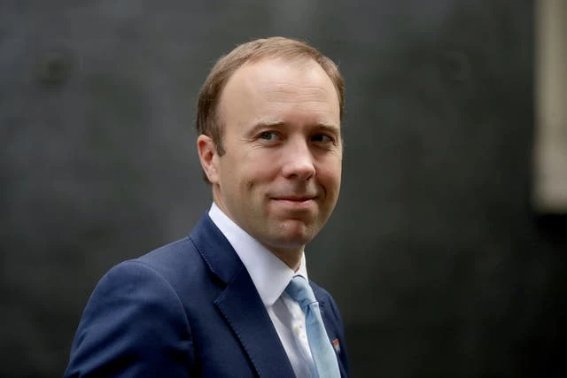 UK health minister admits virus rules breach with embrace
