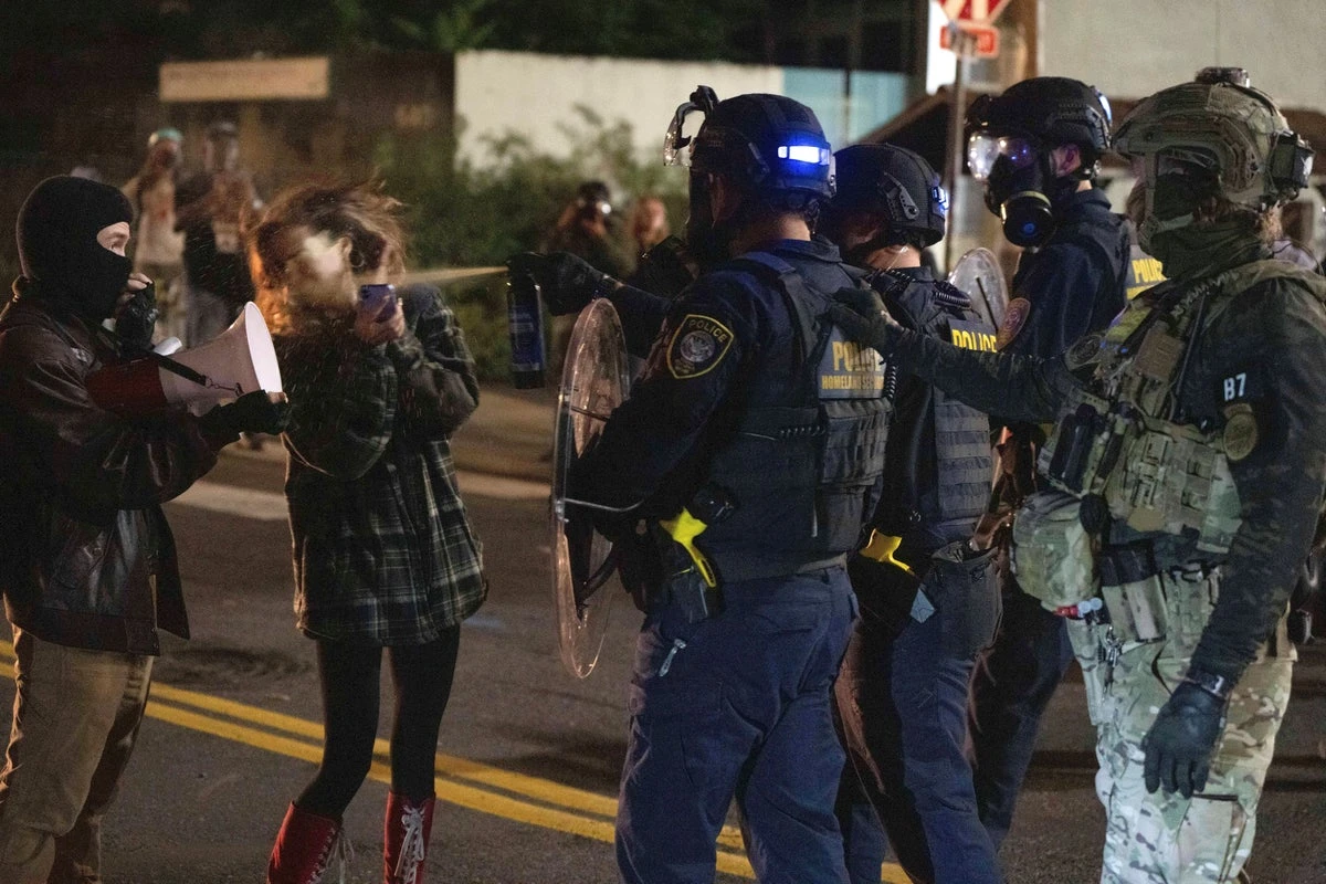 Portland braces for federal troops as protests escalate and conservative influencer is arrested