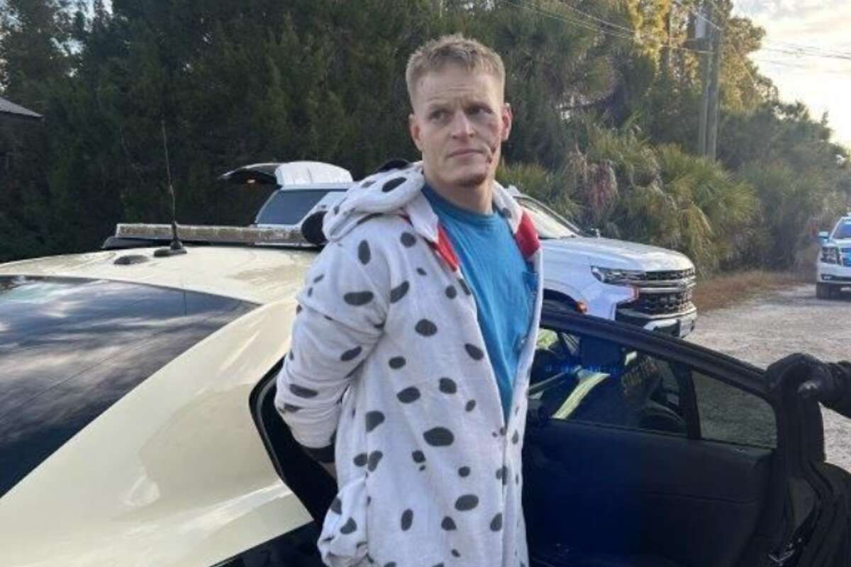 Man in Dalmatian onesie outruns police and K9s with one hand cuffed