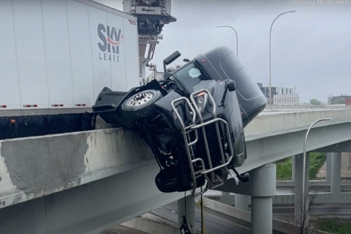 Terrifying moment trucker calls 911 as his cab hangs off bridge