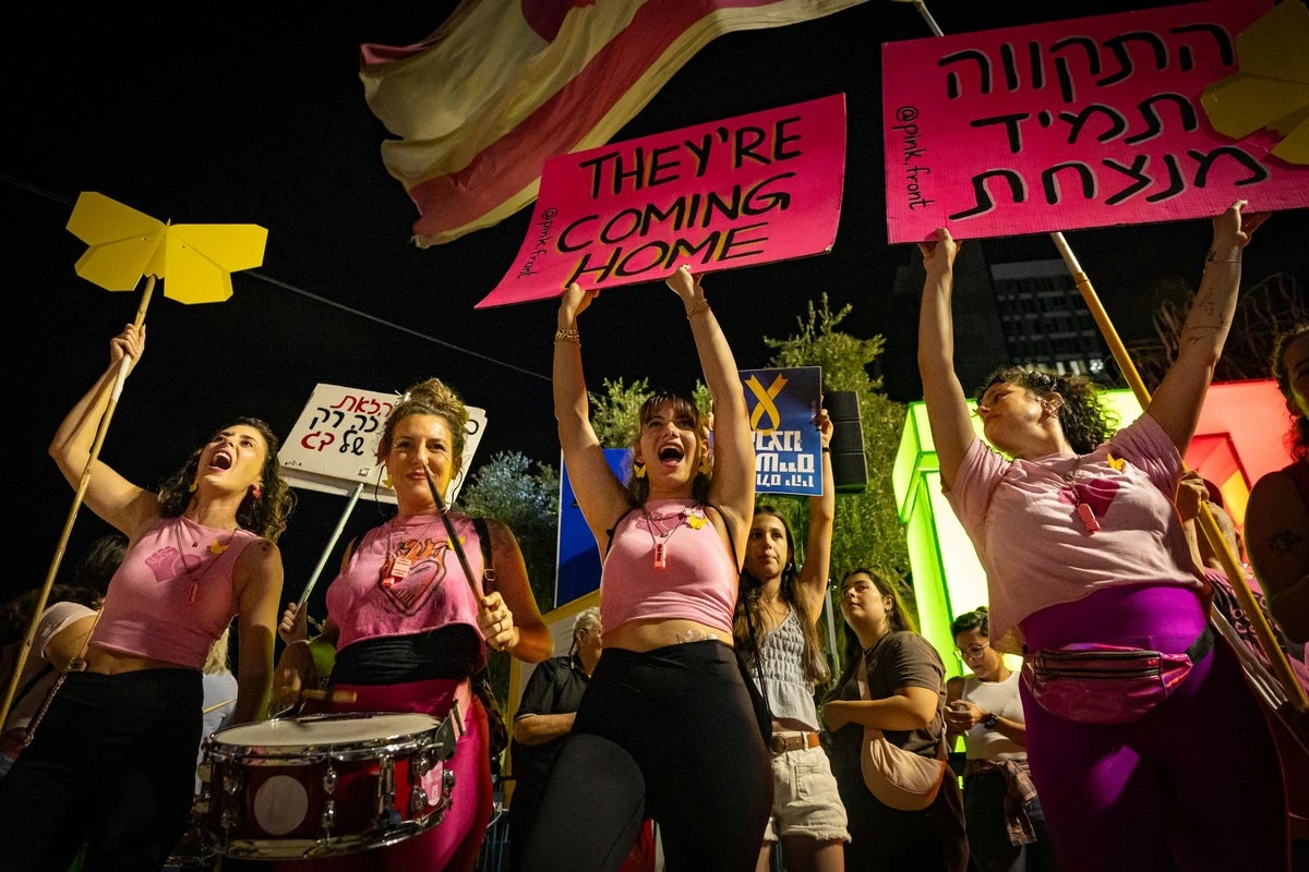 ‘Bring them home now’: Thousands in Israel celebrate truce deal