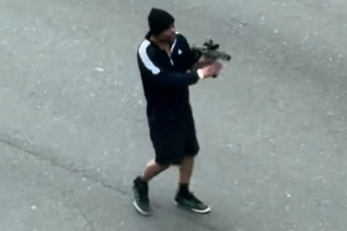 Two critical after gunman fires up to 60 rounds into traffic