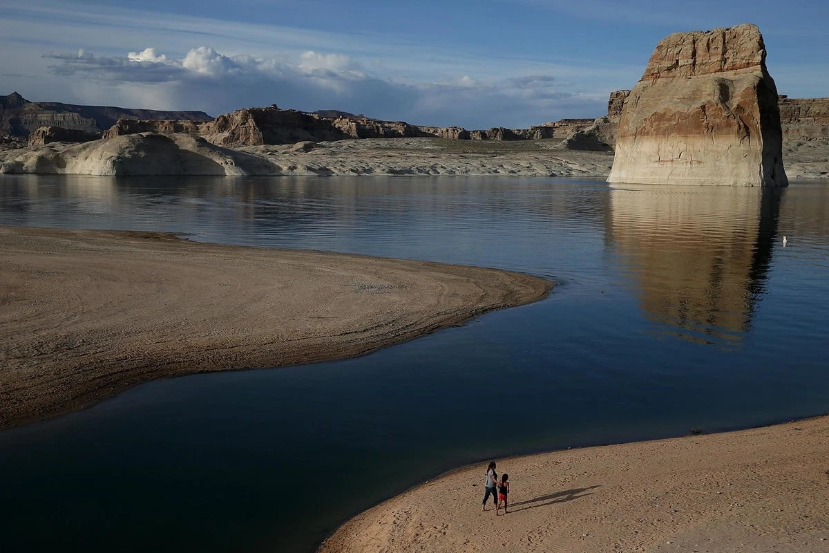 Low water at popular beach reveals truck containing human remains