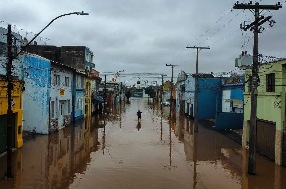 Live: Brazilians navigate floods by boat as at least 90 people dead