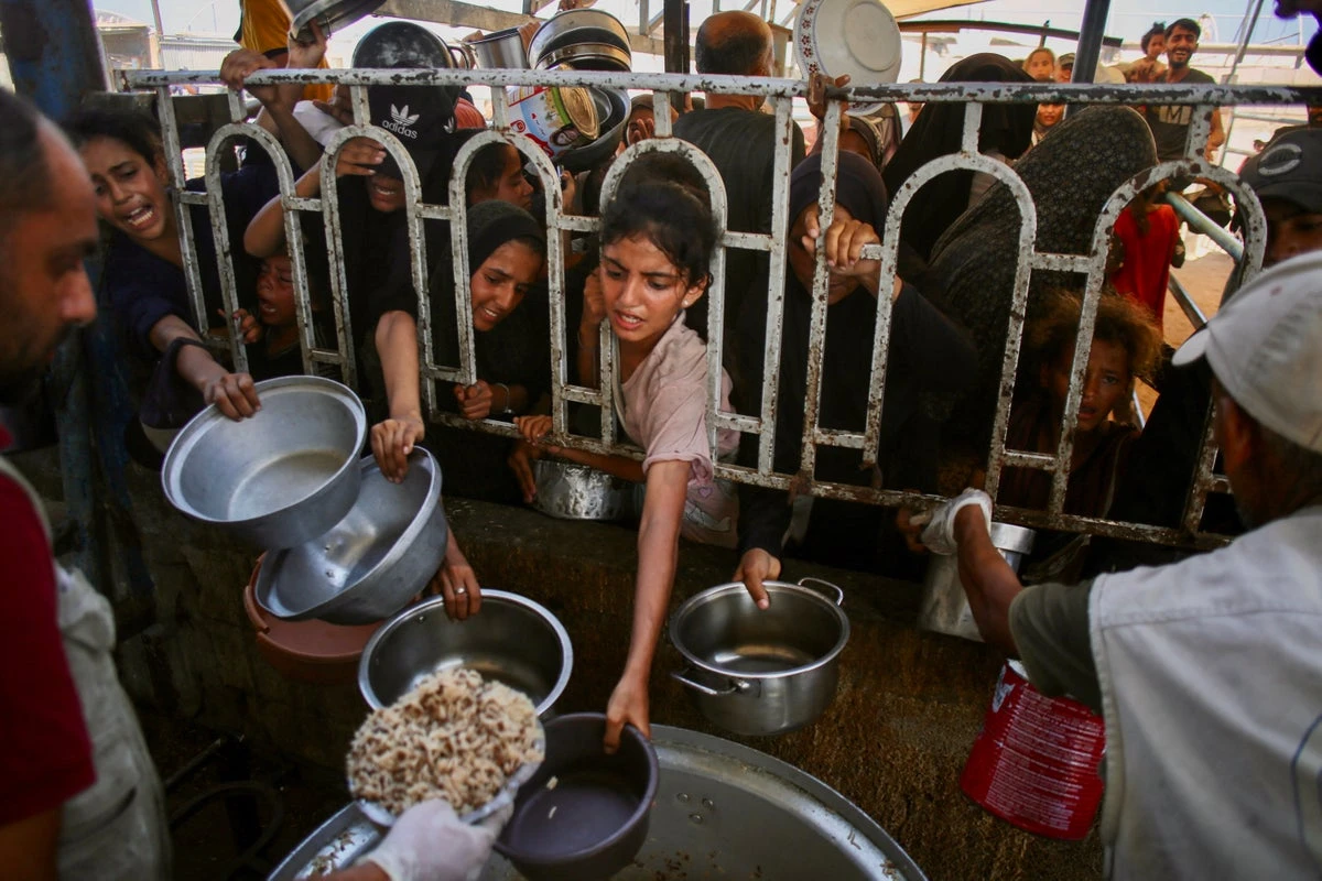 ‘My sister’s kids eat grass in Gaza, here my son spits out his peas’