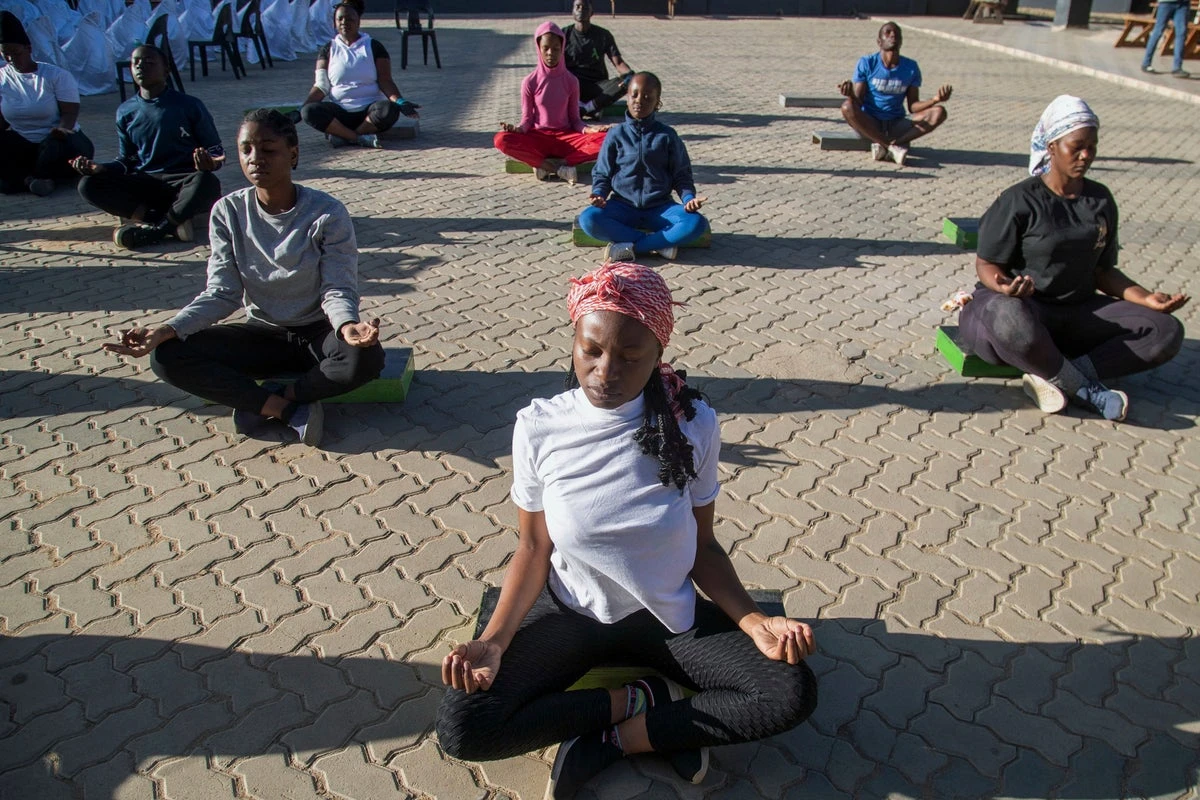 Yoga in a Zimbabwe tavern is the latest mental health outreach in a struggling country