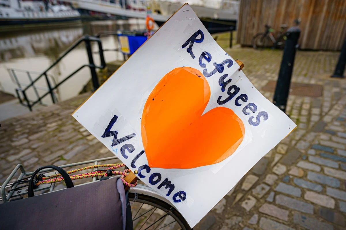 Fears tough English requirements would be applied to refugee families