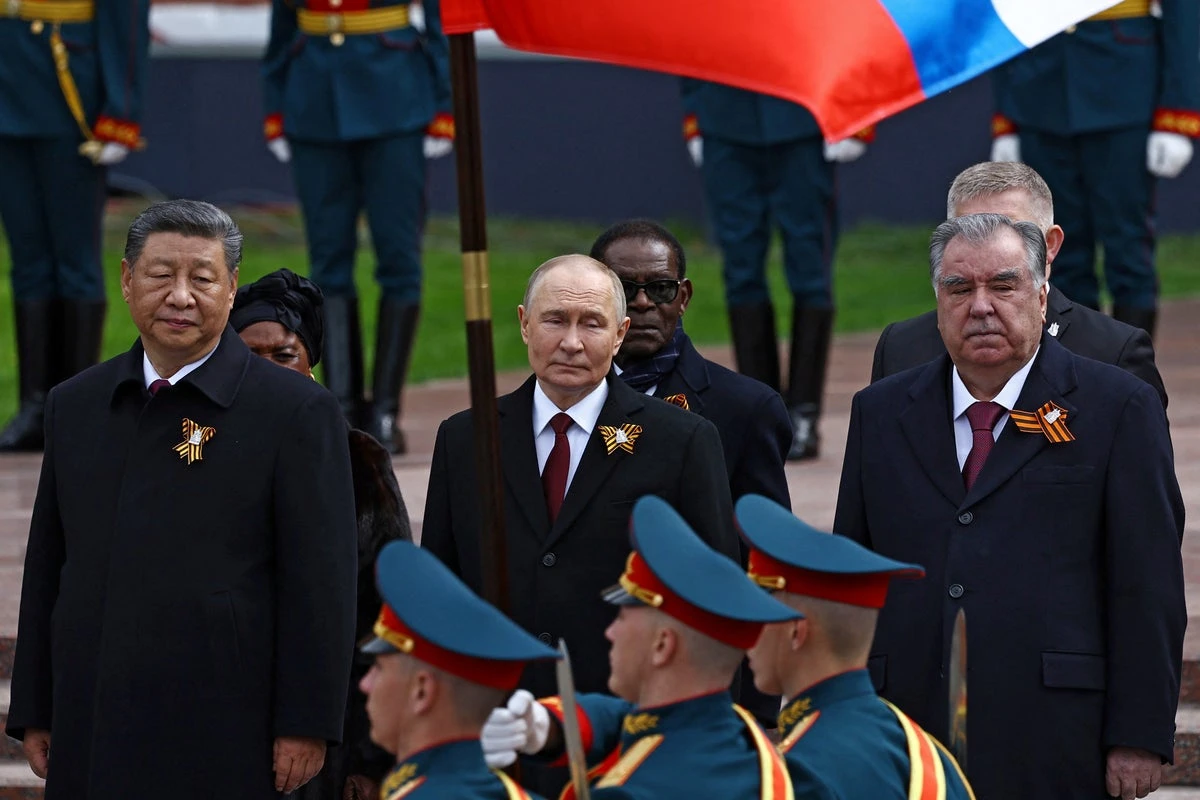 Putin stages Moscow military parade in ‘belligerent’ show of force