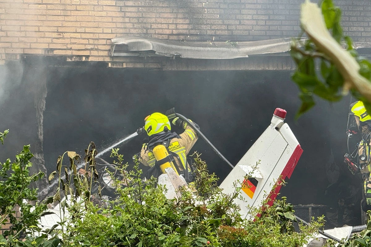 Two killed after small plane crashes into house