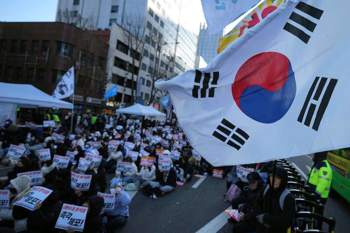 Ruling party chief resigns as South Korean president skips hearing