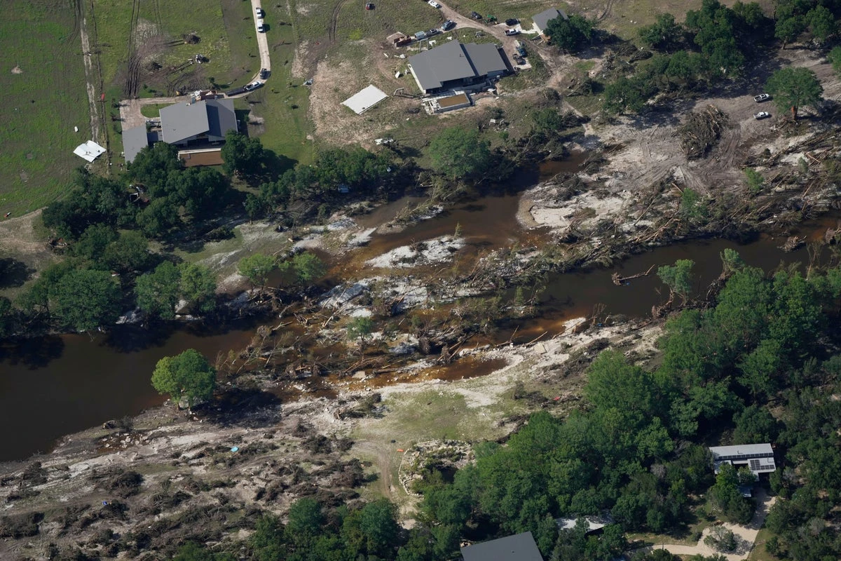 Searchers in helicopters and on horseback scour Texas flood debris for the missing