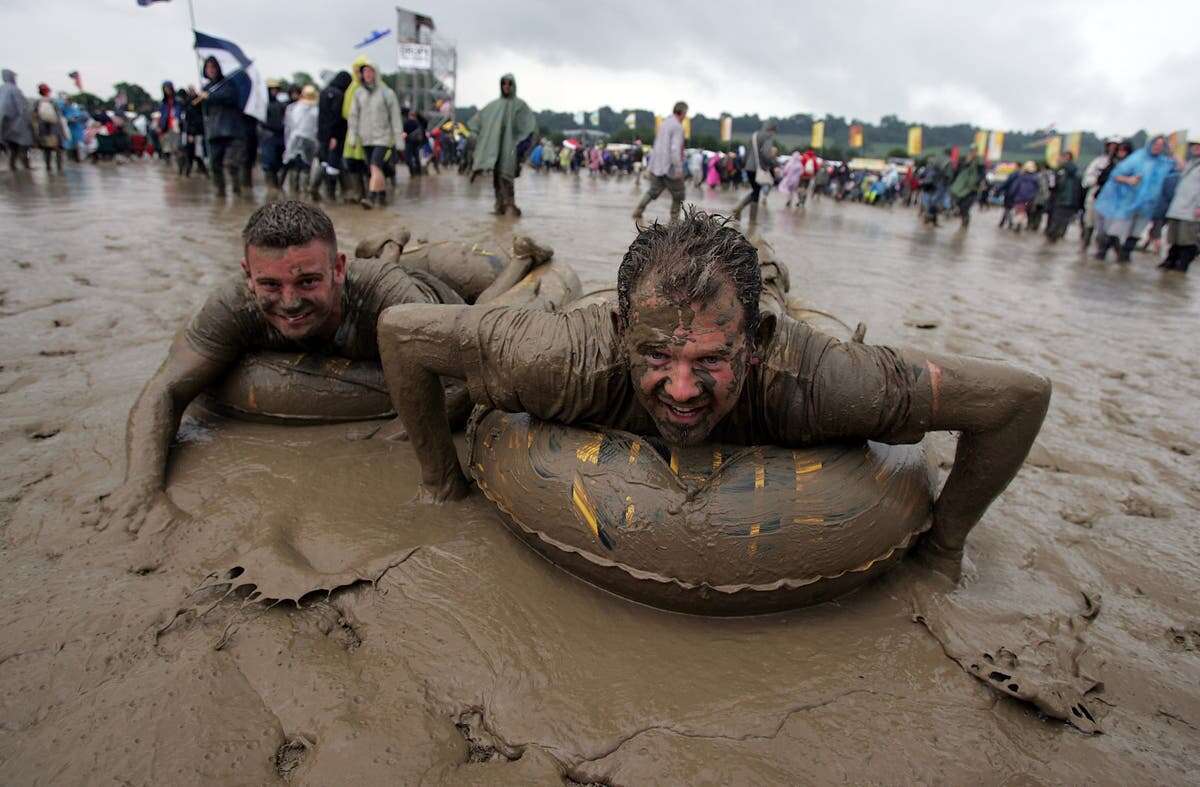 ‘Someone stole my wellies!’: Glastonbury’s five muddiest festivals