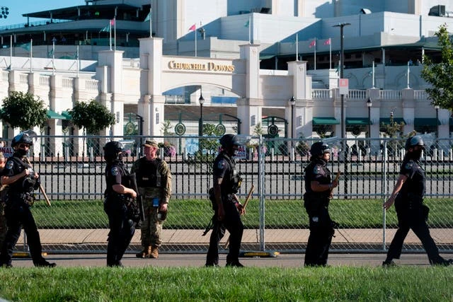 Kentucky police officer charged with beating kneeling protester