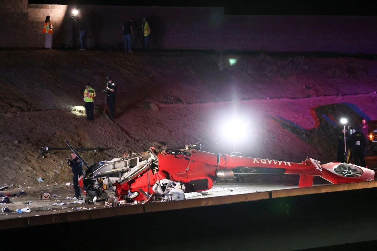 Motorists lift helicopter off trapped paramedic after crash