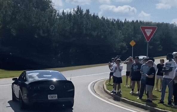 Mustang Driver Almost Saves It Leaving A Car Meet—Almost