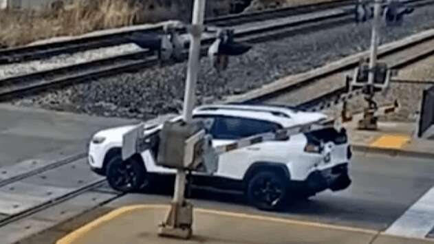 What Would You Do If Rear-Ended Onto Train Tracks Like This Jeep Driver?