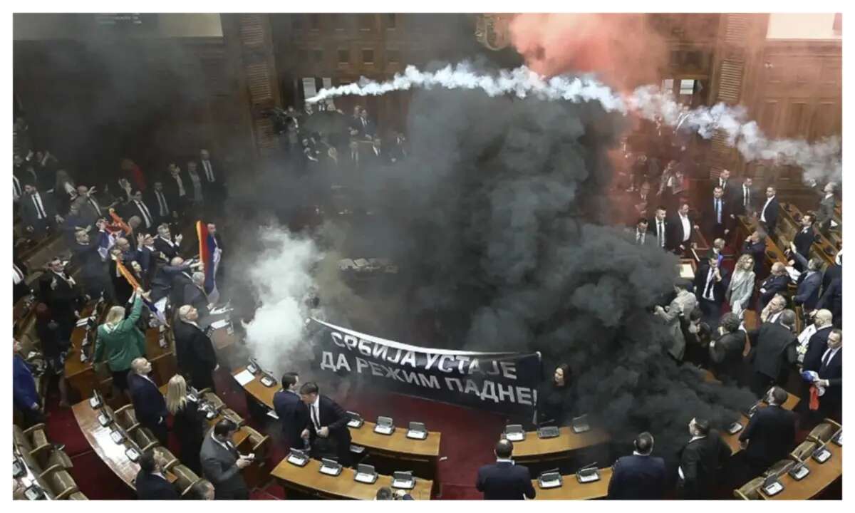 3 injured as Serbian lawmakers throw smoke grenades, tear gas in parliament