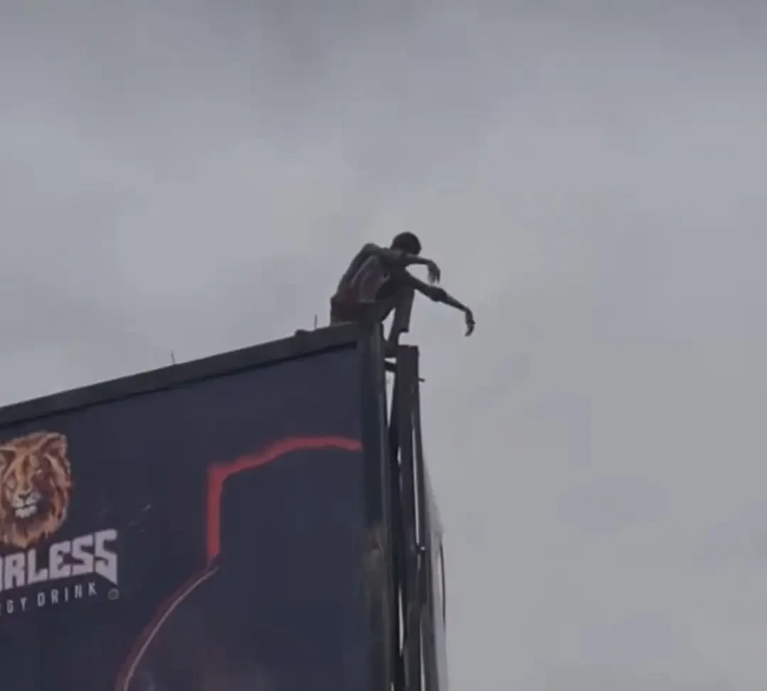 Tension in Kano as man remains hanging in tall billboard, attempts taking own life 
