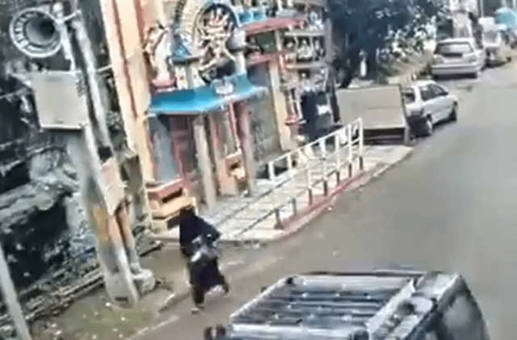 That was close! Woman narrowly escapes collapsing building
