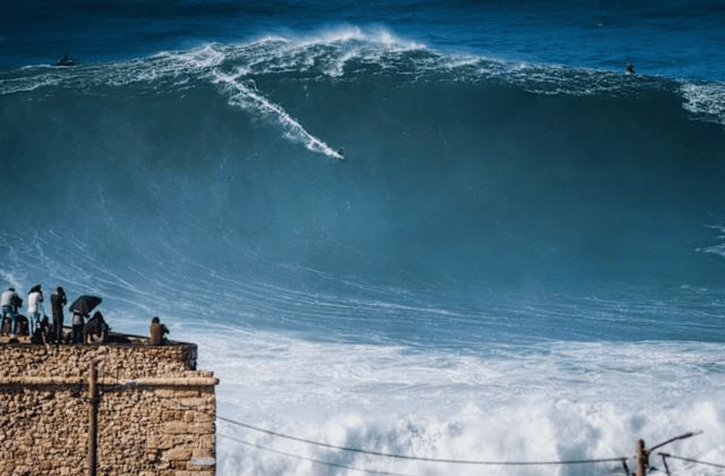 Surfers take on enormous waves at Nazare
