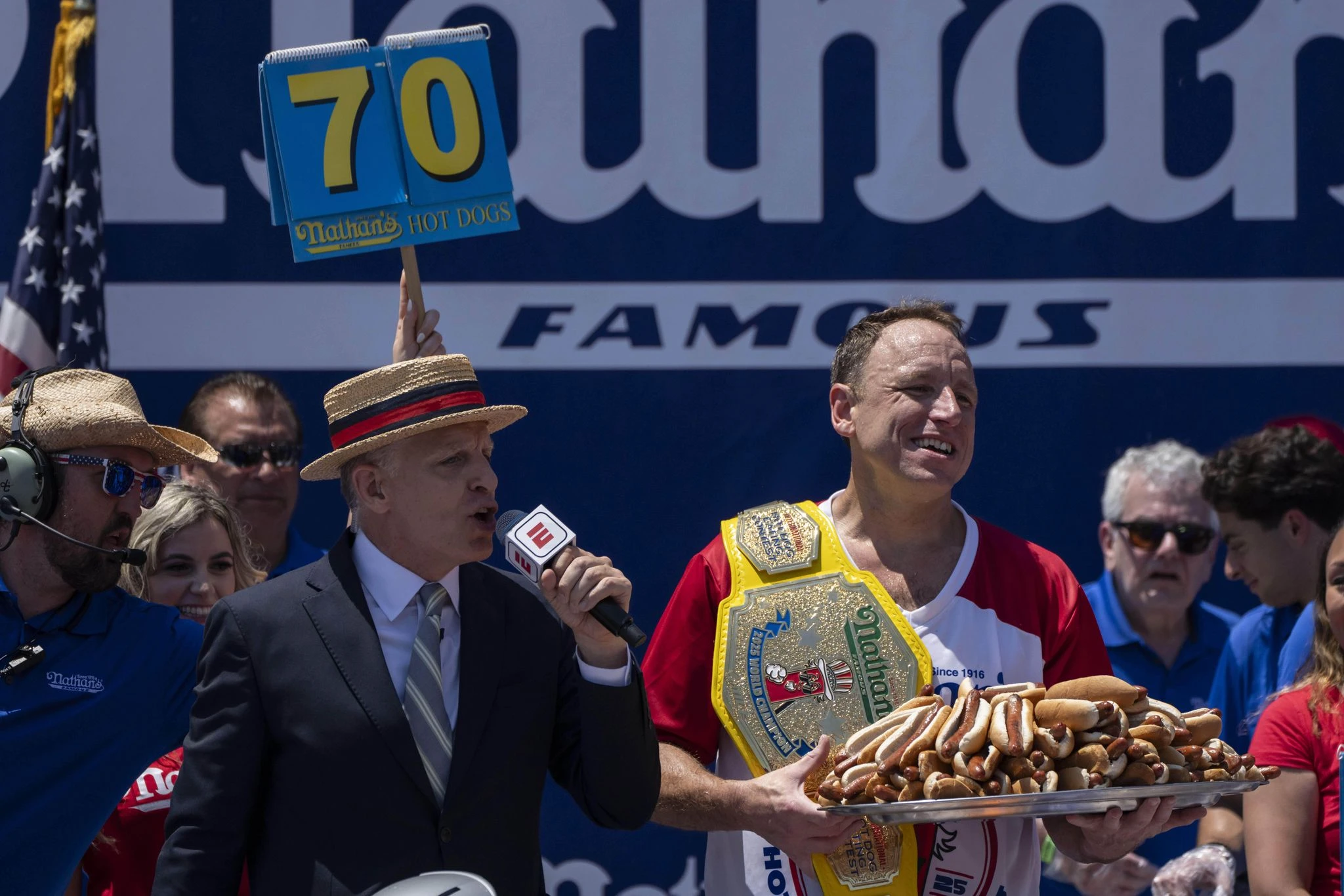 Joey Chestnut reclaims title in Nathan's Famous hot dog eating contest, wins 17th Mustard Belt