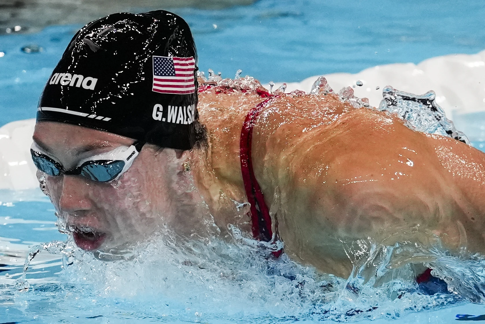 Swimmer who grew up in CT sets Olympic record in 100 butterfly
