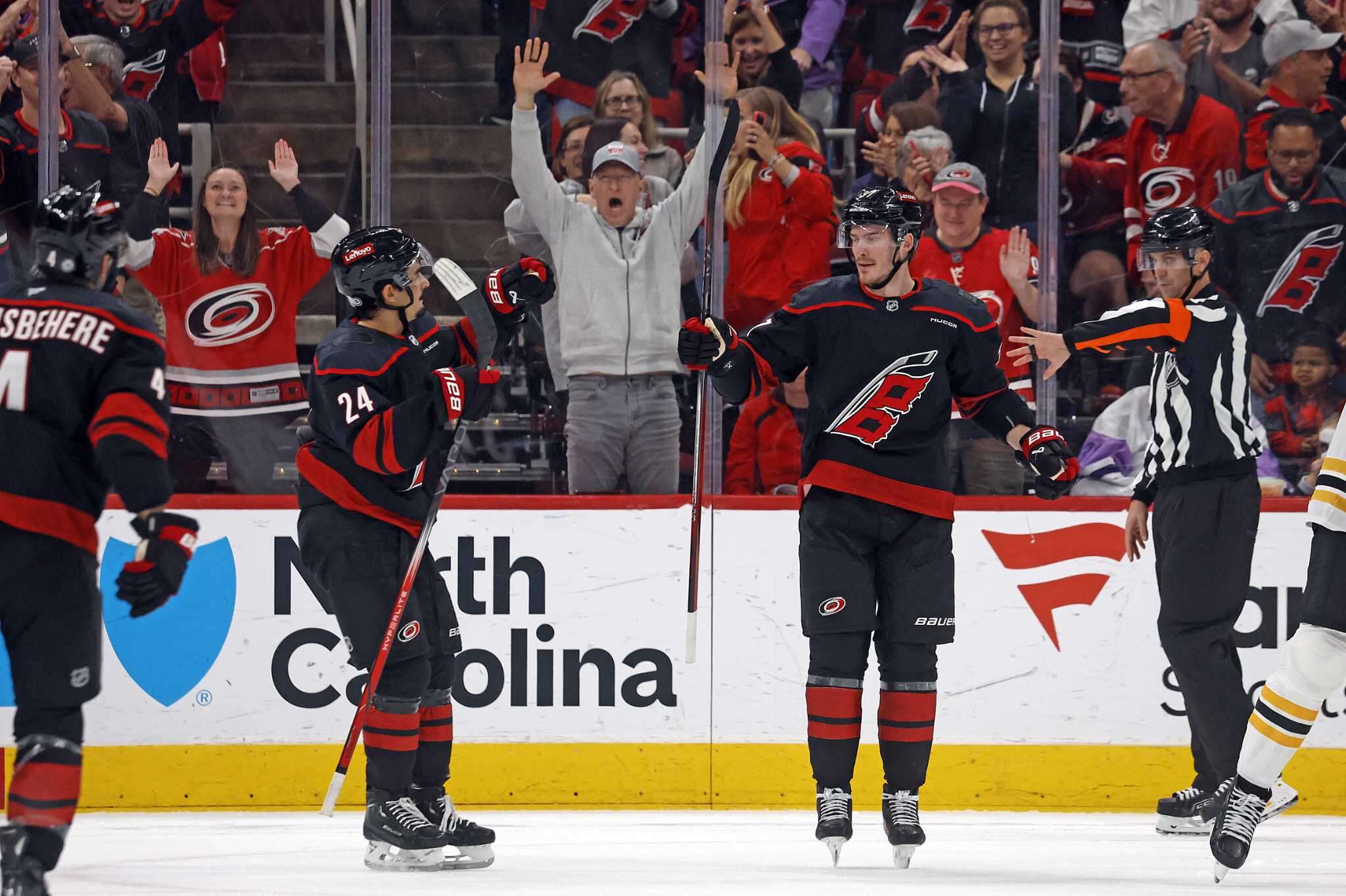 Roslovic, Svechnikov each score twice to help the Hurricanes rout the Bruins 8-2