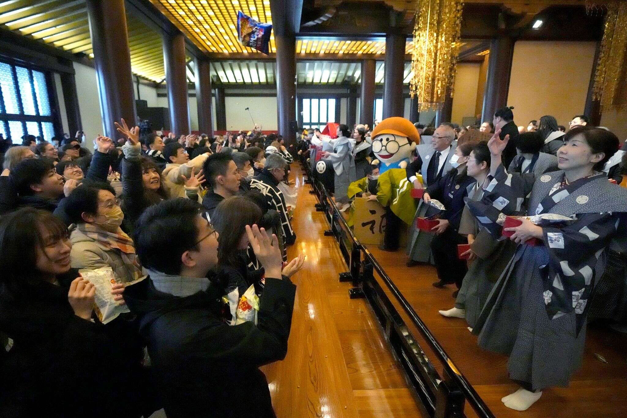 AP PHOTOS: Japanese mark the end of winter with bean-throwing ritual to ward off evil spirits