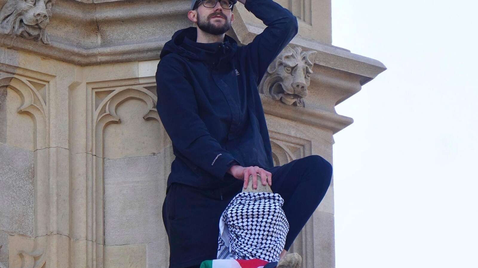 Emergency services called after a man with a Palestinian flag climbs up Big Ben tower