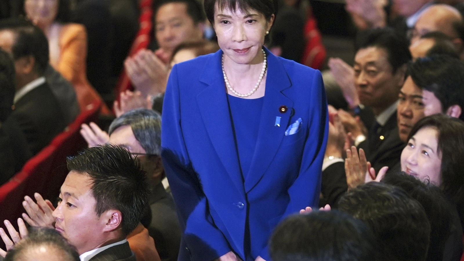 Japan's first female governing-party leader is an ultra-conservative star in a male-dominated group
