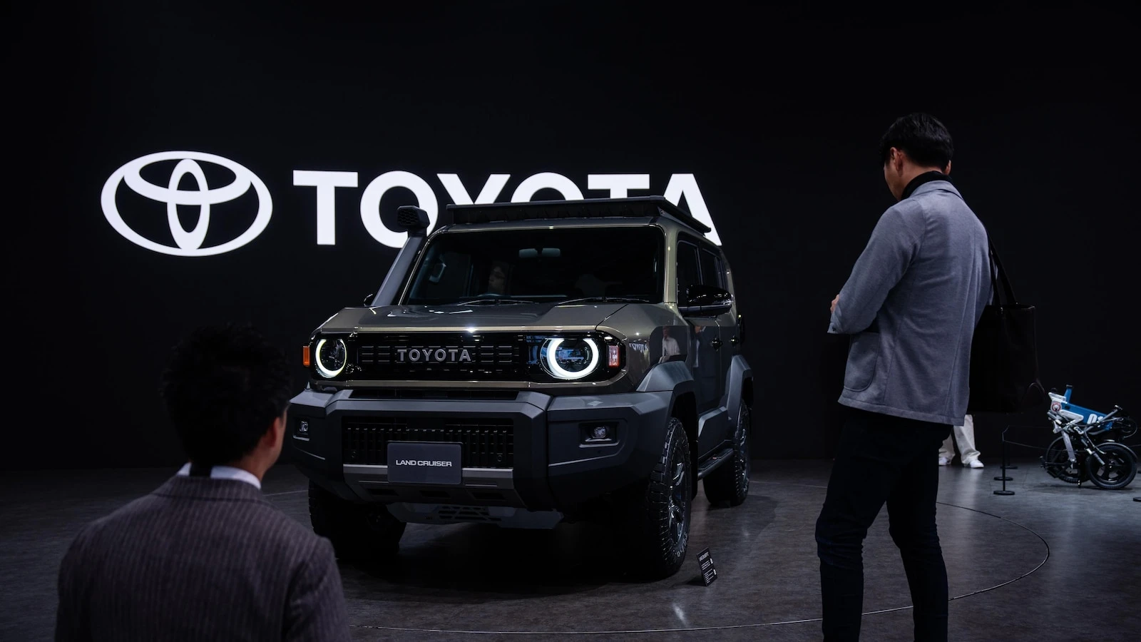 Japan's Toyota, hurt by President Trump's tariffs, reports a drop in profit