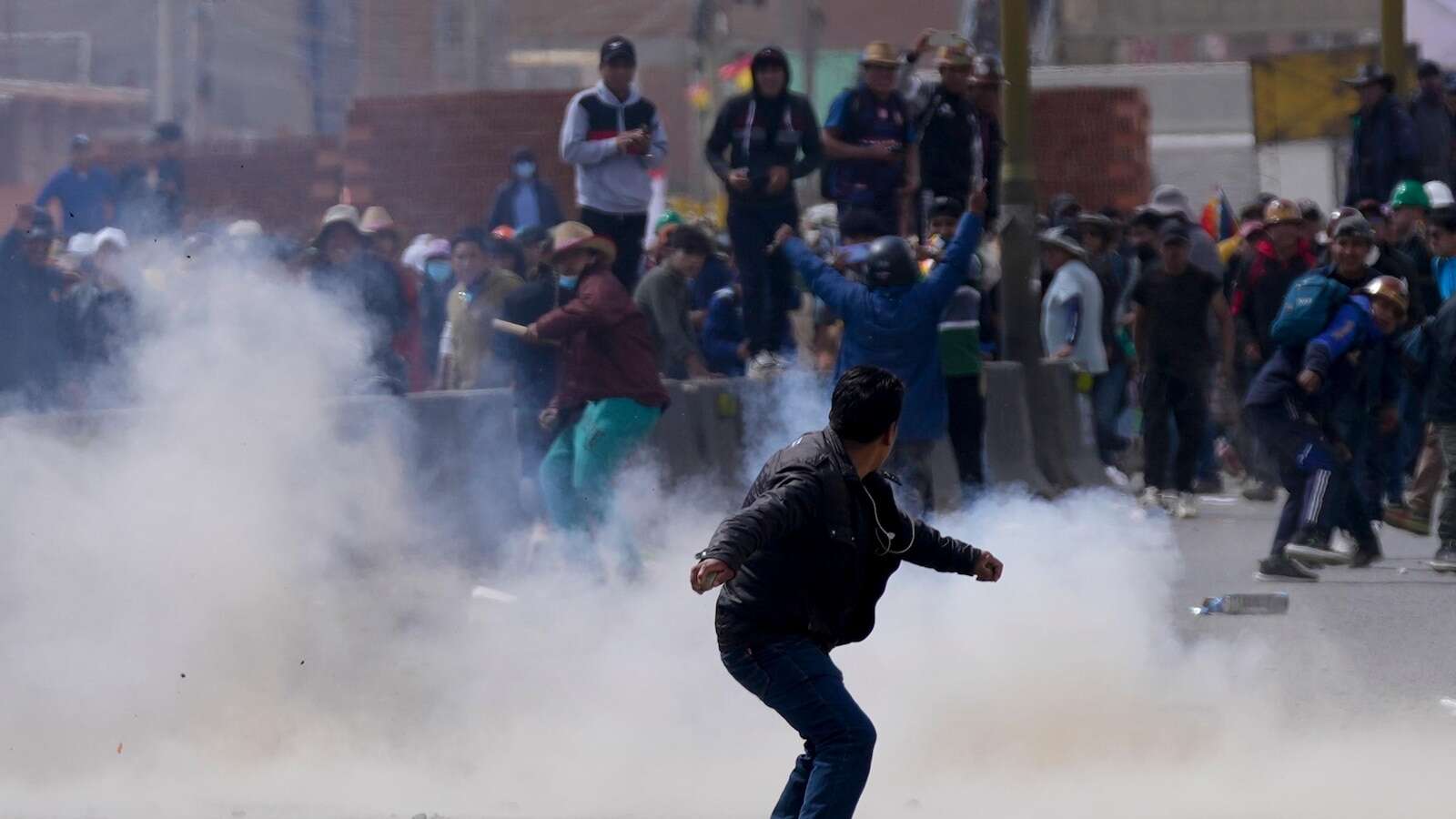 Rival protesters clash in Bolivia as ex-President Evo Morales leads a march to the capital