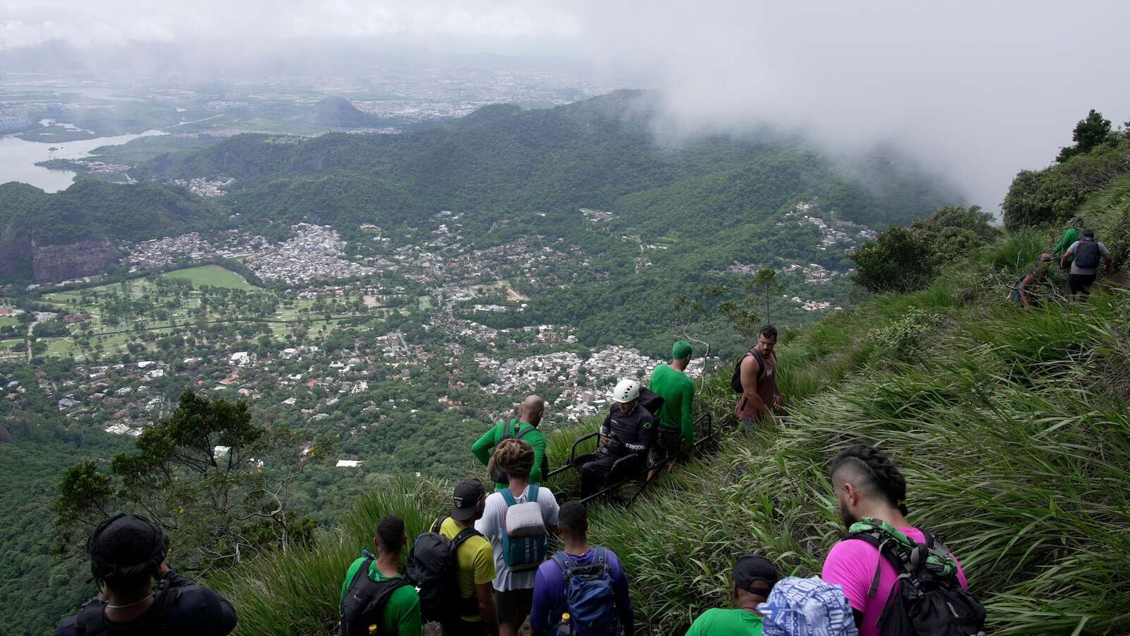 At one of Rio de Janeiro's hardest trails, a paraplegic athlete climbed into clouds