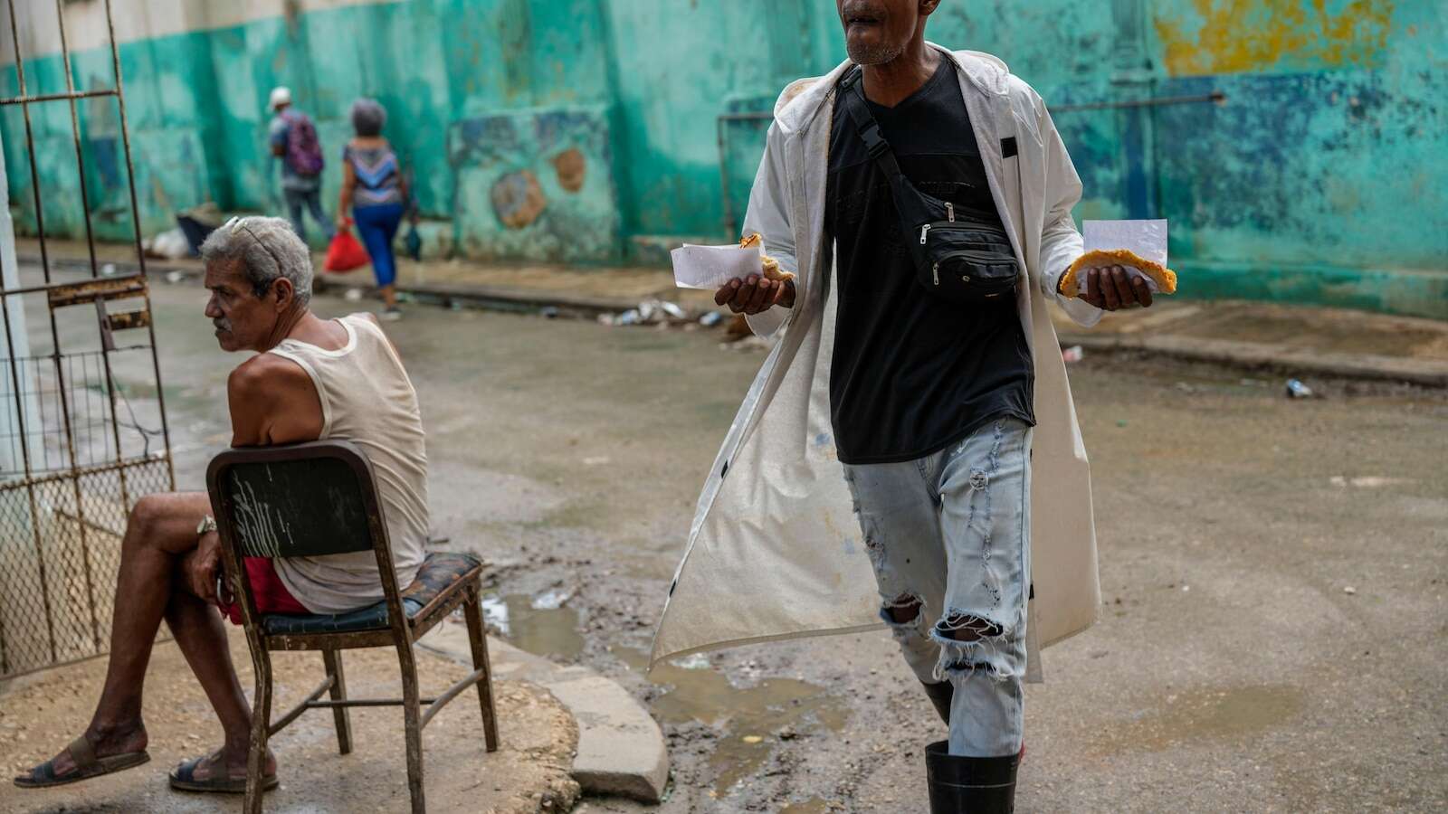 Cuba fights to come back from a nationwide blackout, then a storm that killed six