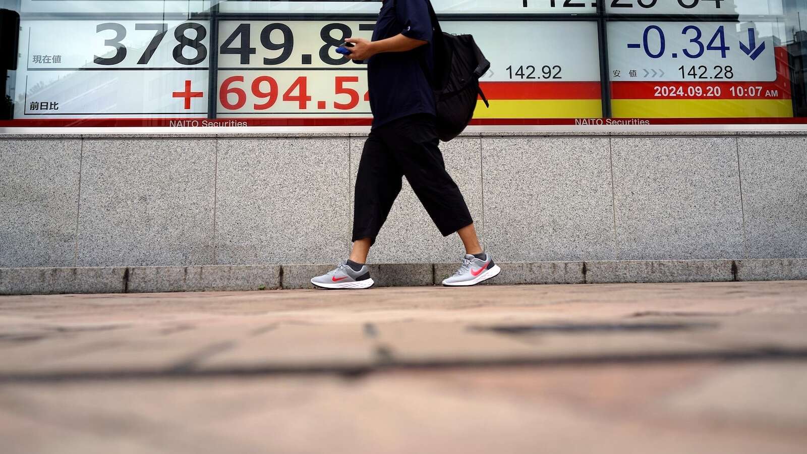 Asian stocks follow Wall Street's rate-cut rally higher, as BOJ stands pat