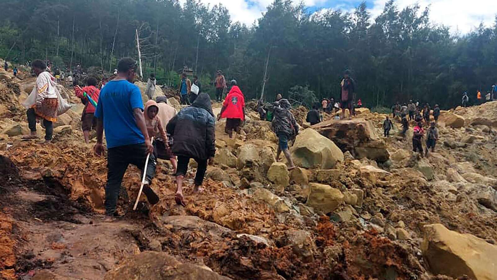 Emergency crews in Papua New Guinea move survivors of massive landslide to safer ground