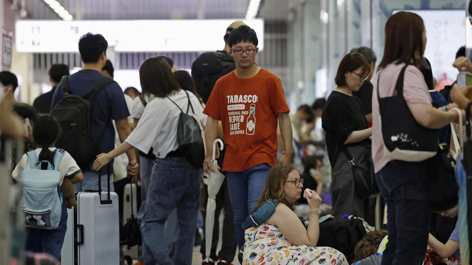 Heavy rains in Japan cause flooding and mudslides, and leave several people missing