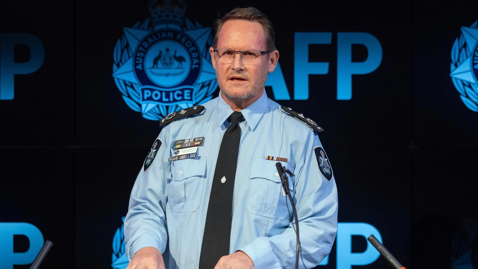 Woman becomes third person charged under Australia's foreign interference laws