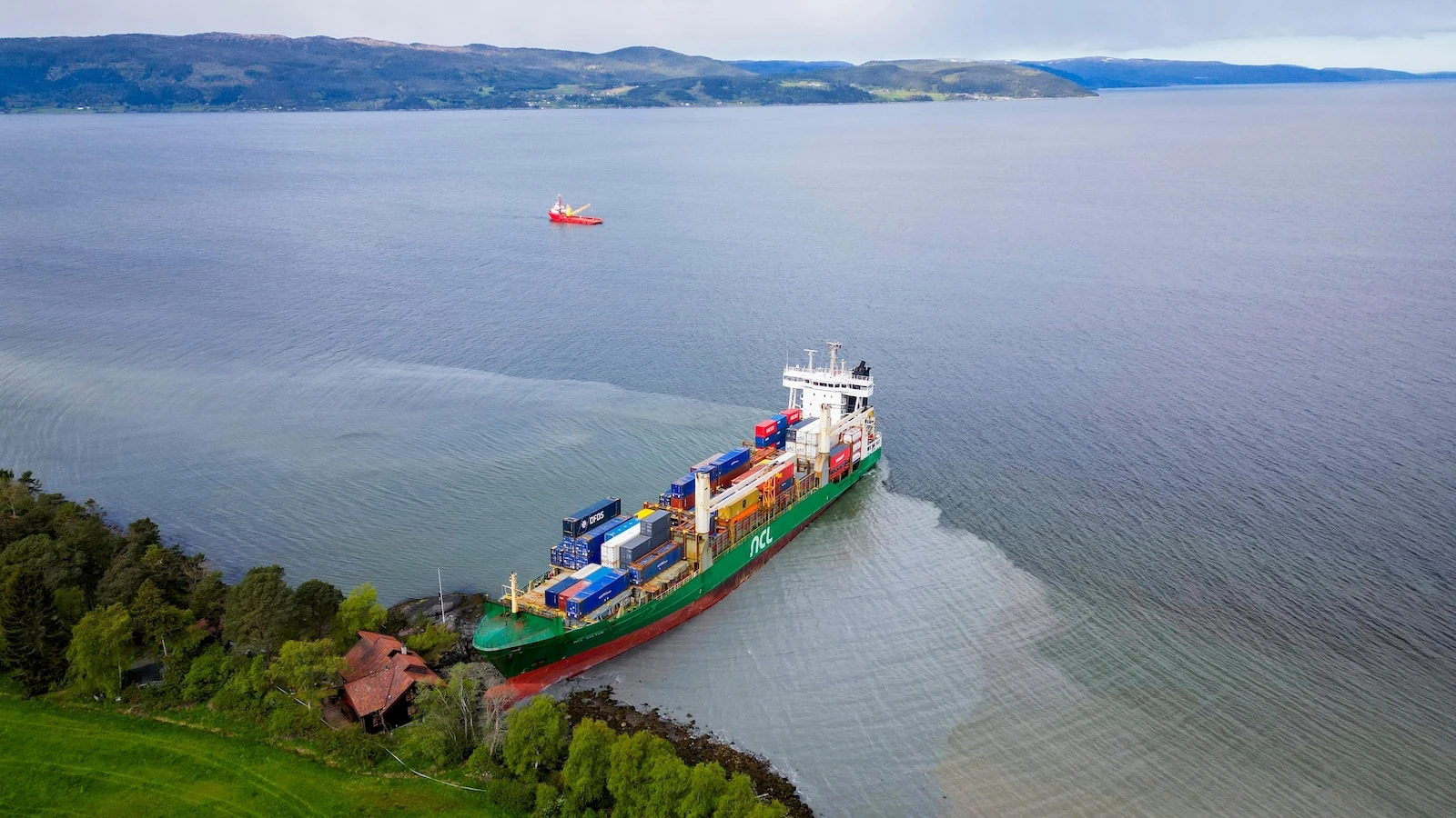 On-duty navigator was allegedly asleep when cargo ship ran aground in Norway and nearly hit a house