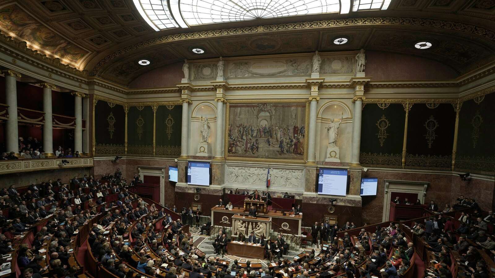 French lawmaker who uses a wheelchair wins a change in voting rules that discriminated against him