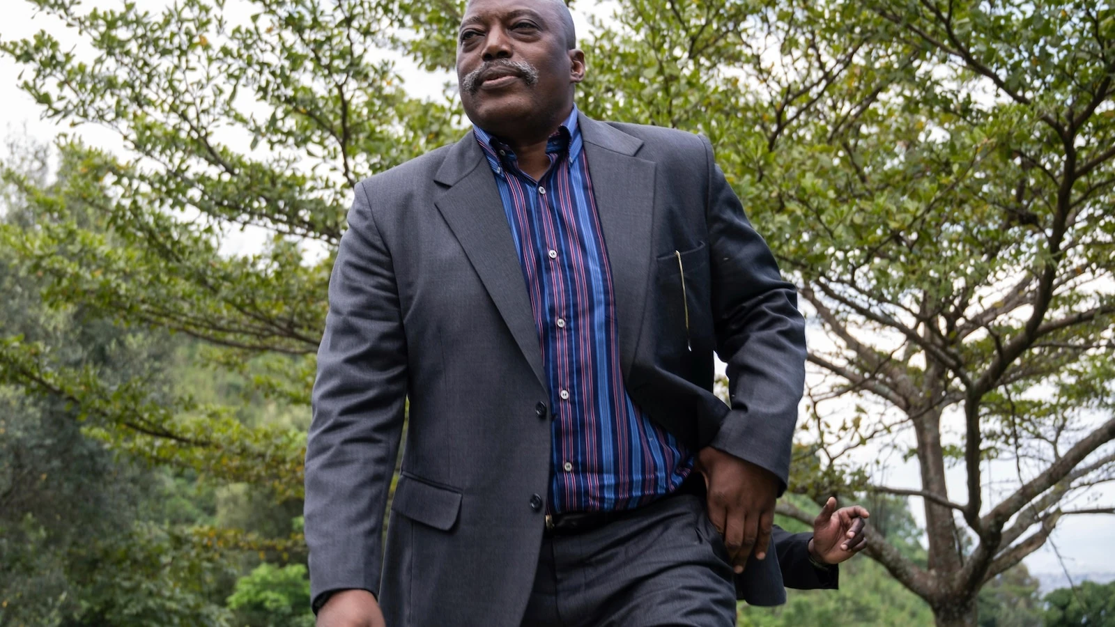 Former Congo leader appears at political meeting despite absentia death sentence