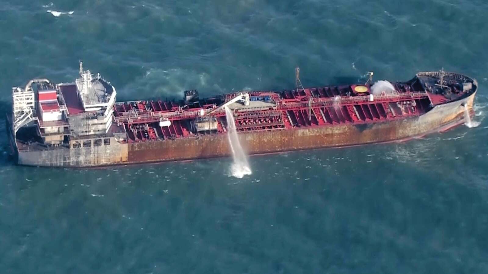 Race to contain fire continues after tanker-container ship collision in North Sea