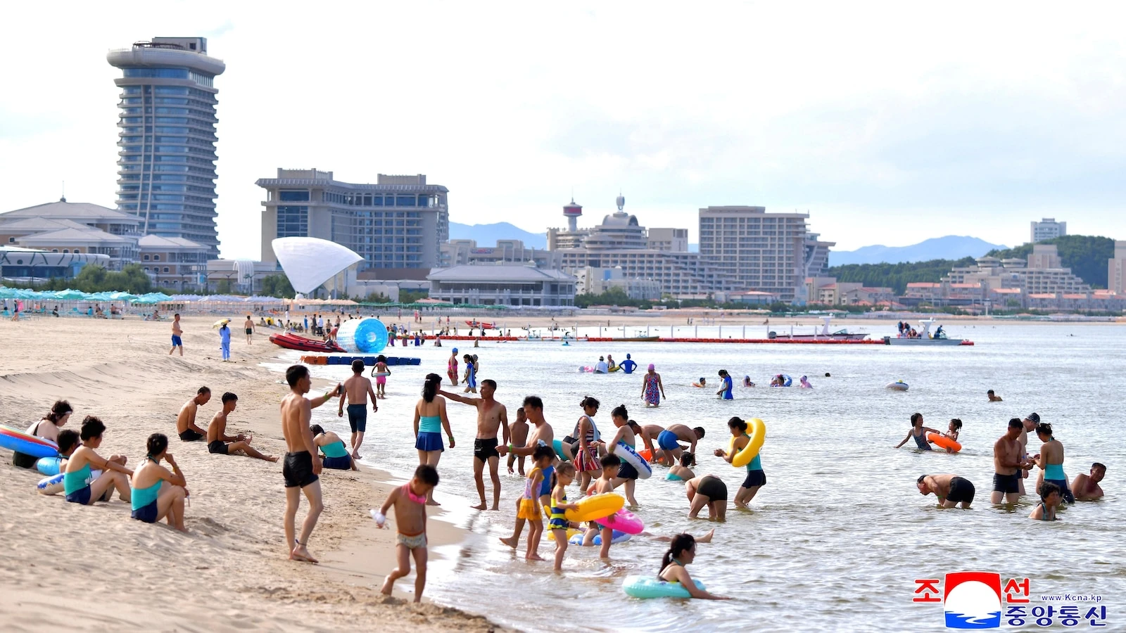 North Koreans swim and play at a beach resort touted as a boost for tourism