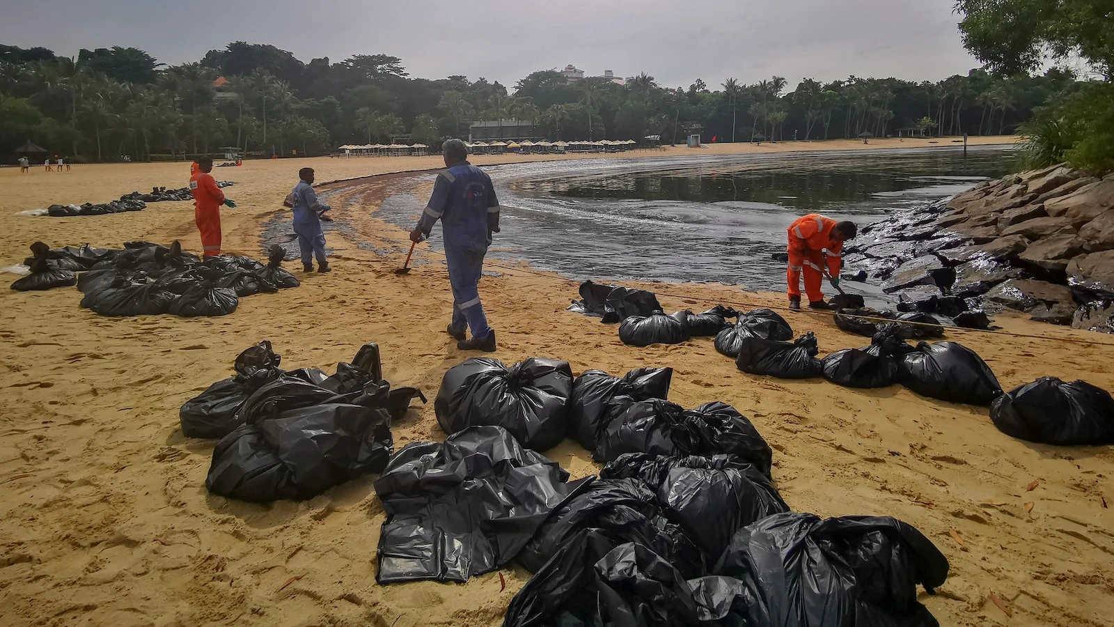 Singapore rushes to clean-up oil slick after boat hits stationary fuel supply ship