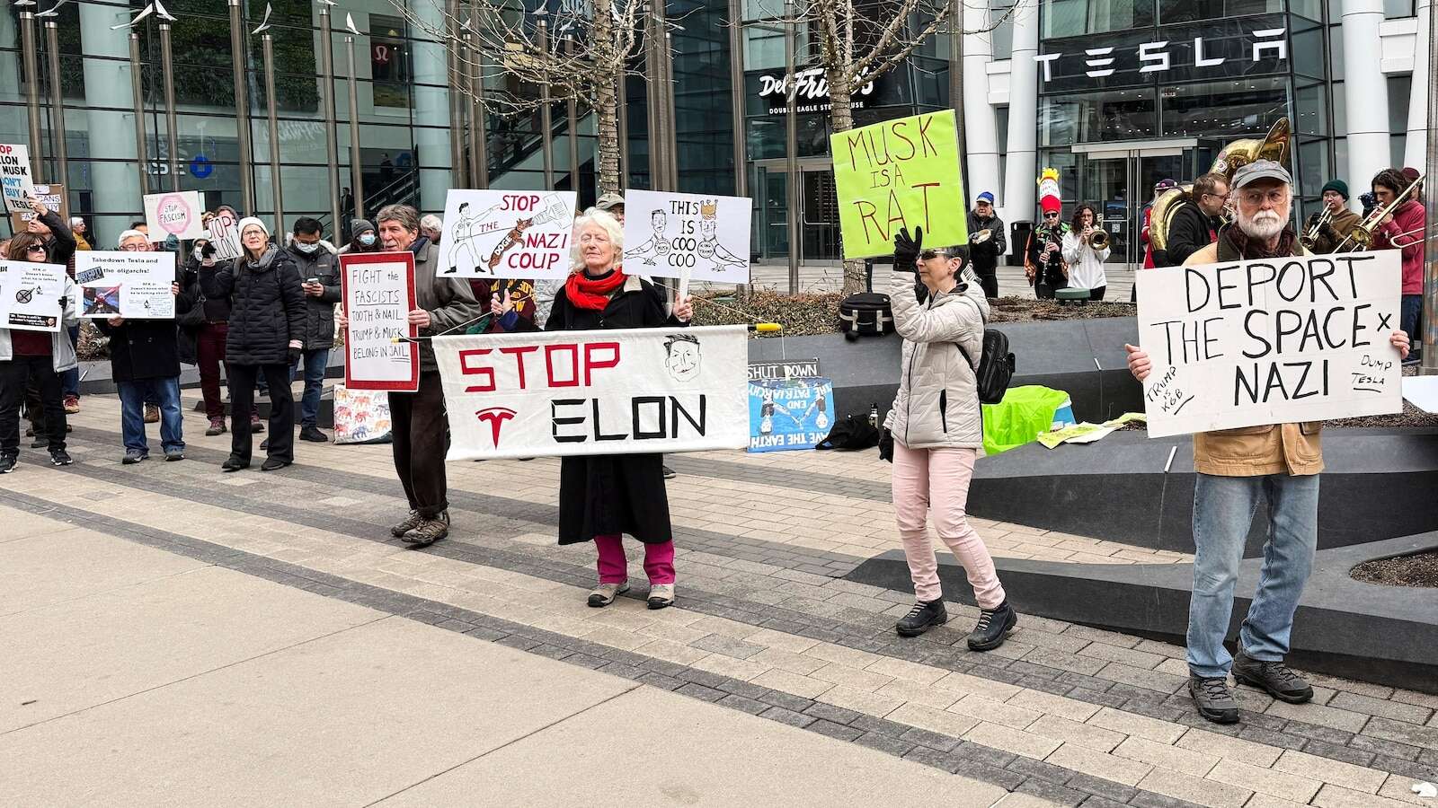 Anti-DOGE protests at Tesla stores target Elon Musk's bottom line